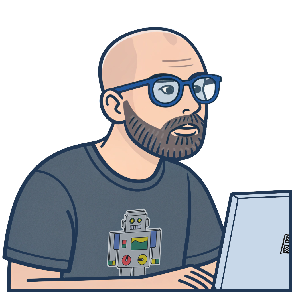 A bearded, bald programmer with glasses working on his laptop.